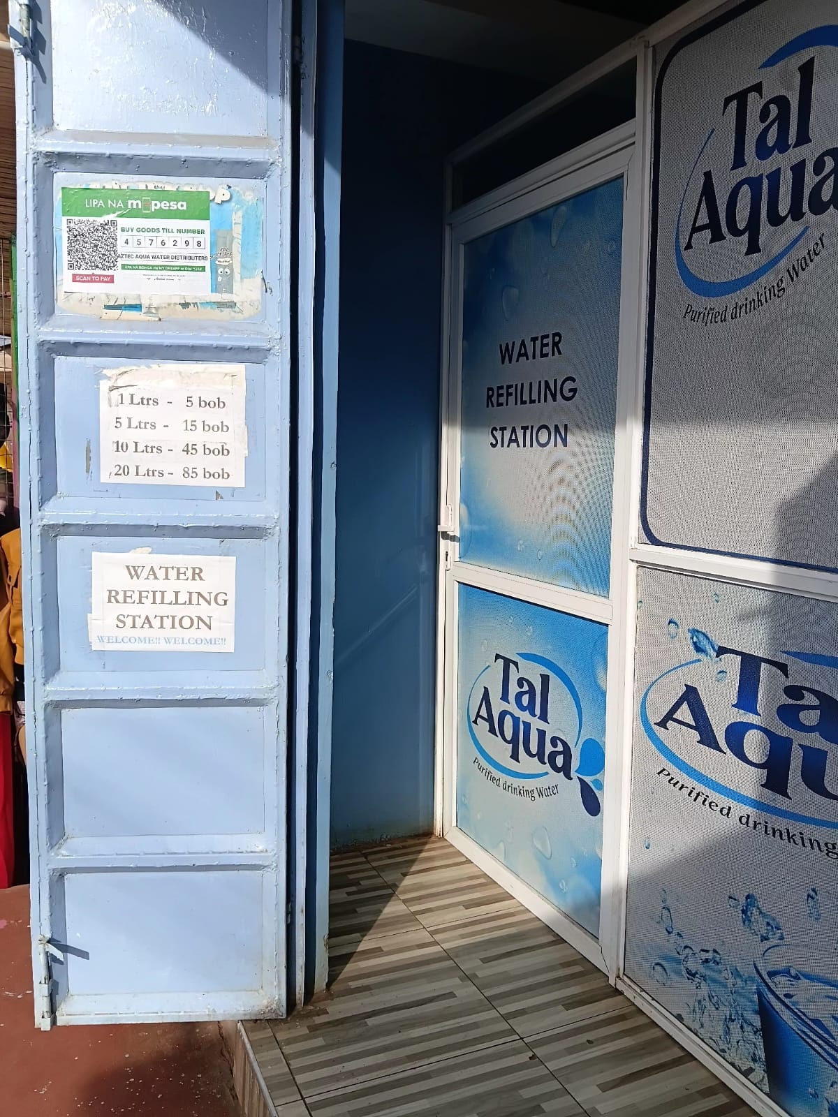 Tal Aqua refill station entrance with clear pricing